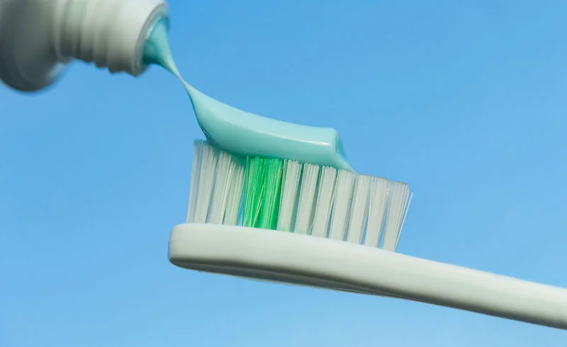 toothpaste on a toothbrush