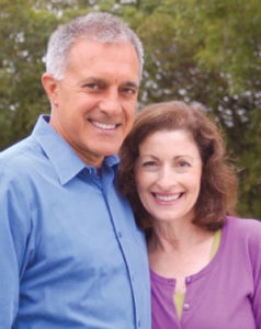 Couple smiling dentures Clinton Township, MI
