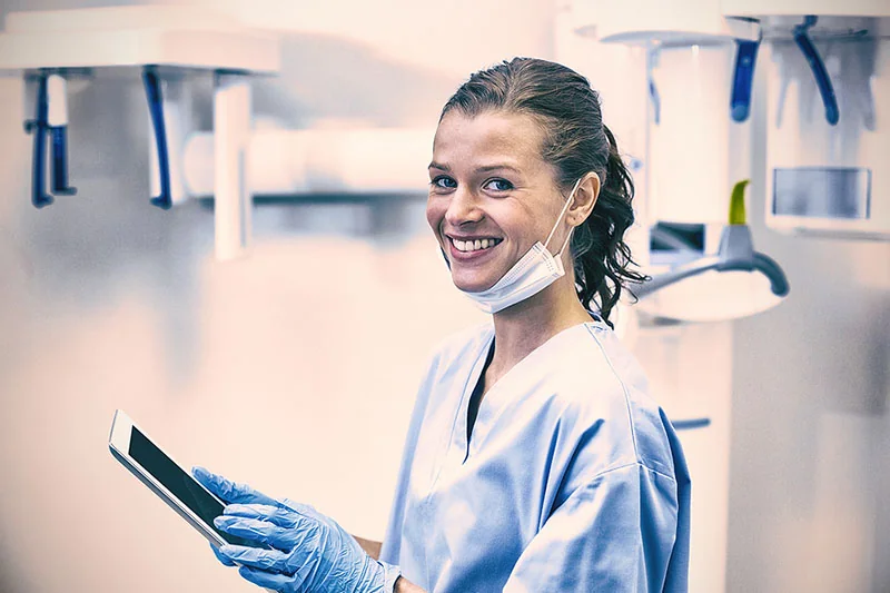 dental hygienist smiling in a dental office
