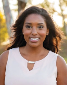 Woman smiling outside dental bonding Clinton Township, MI 48036